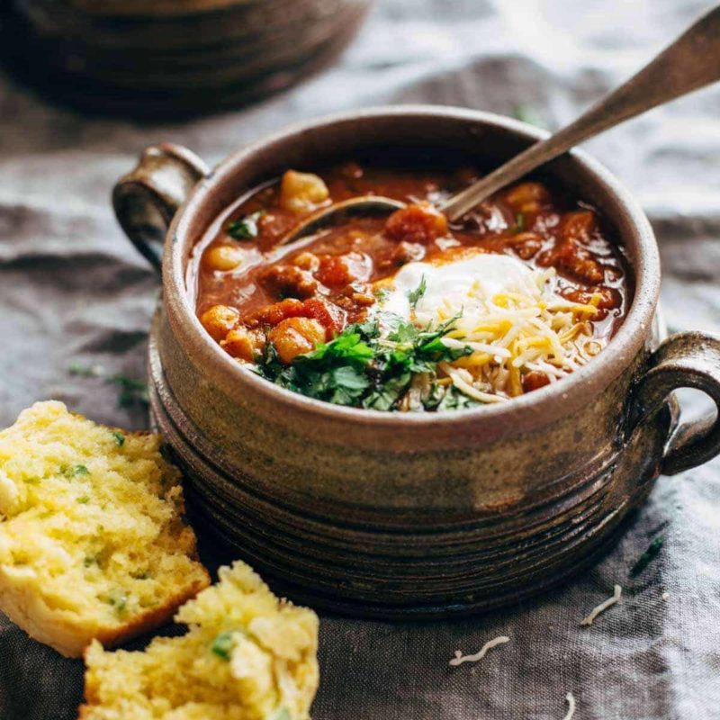 A picture of Spicy Posole with Cheesy Jalapeño Cornbread Muffins